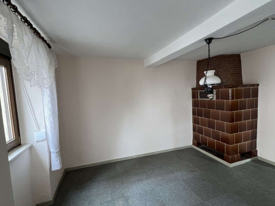 Kachelofen im Wohnzimmer EG Einfamilienhaus Feilbingert