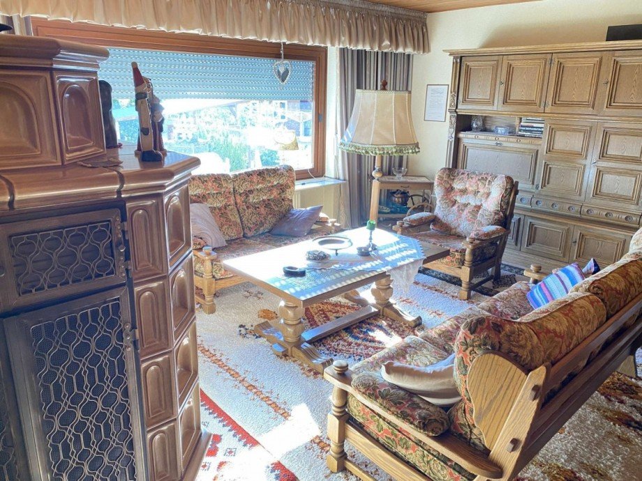 Wohnzimmer mit Kachelofen Haus Simmertal