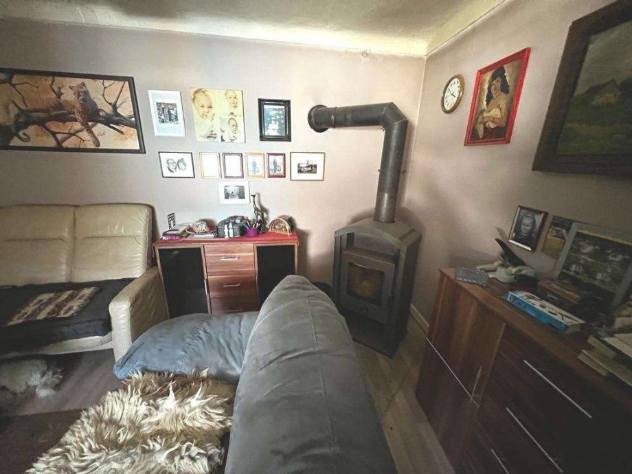 Wohnzimmer EG mit Kamin Renditeobjekt Adenbach